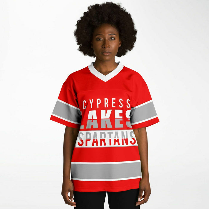 Black woman wearing Cypress Lakes Spartans football Jersey