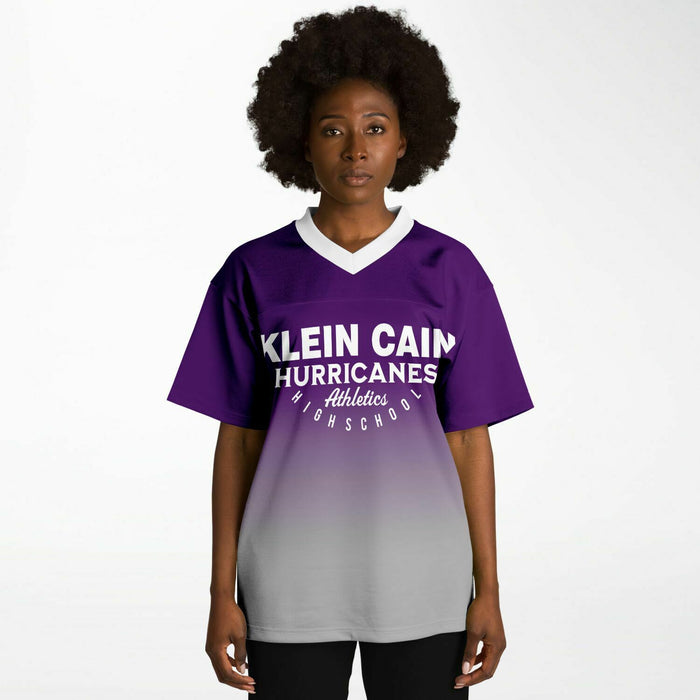 Black woman wearing Klein Cain Hurricanes football Jersey