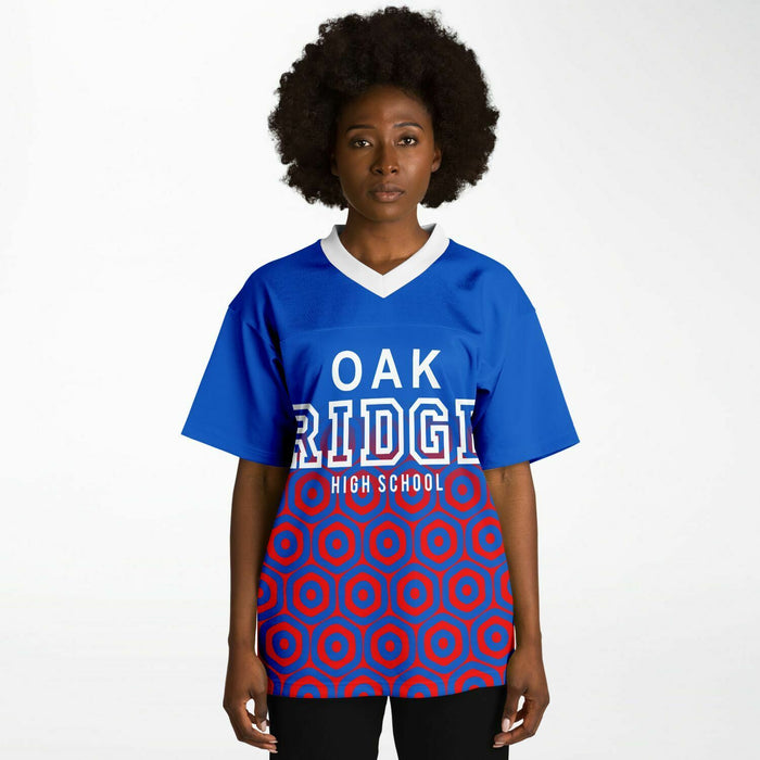 Black woman wearing Oak Ridge War Eagles High School football Jersey