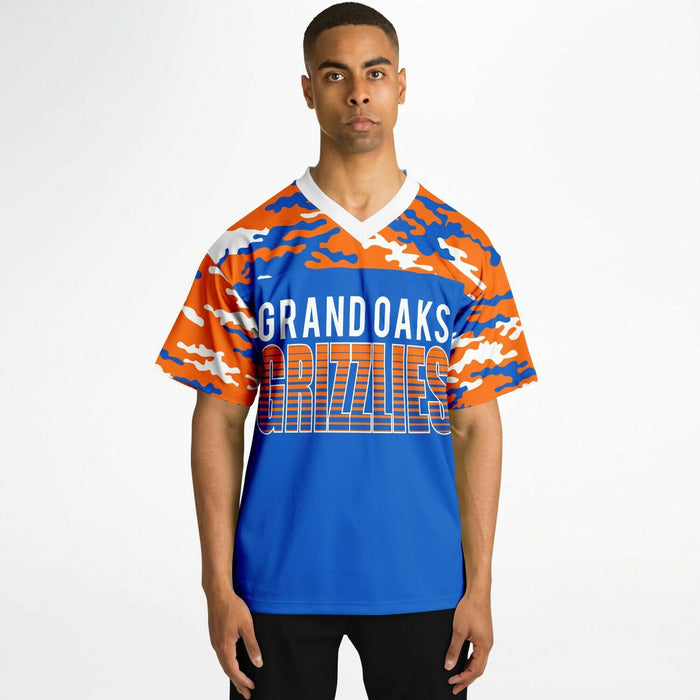 Black man wearing Grand Oaks Grizzlies football Jersey