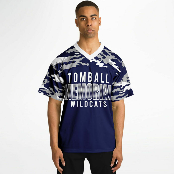 Black man wearing Tomball Memorial Wildcats High School football Jersey