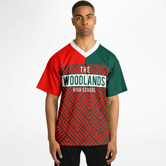 Black man wearing The Woodlands Highlanders High School football Jersey