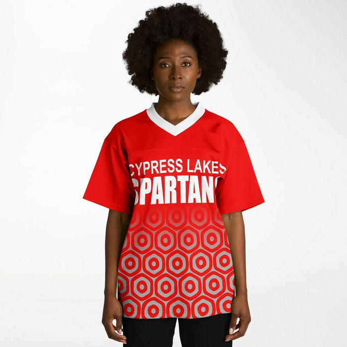 Black woman wearing Cypress Lakes Spartans football Jersey