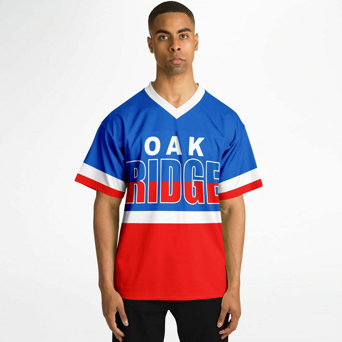 Black man wearing Oak Ridge War Eagles High School football Jersey