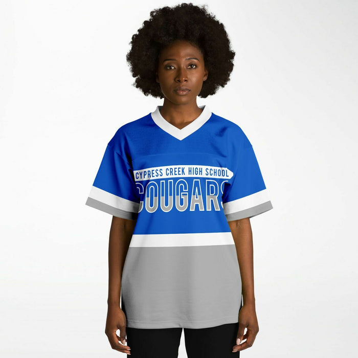 Black woman wearing Cypress Creek Cougars football Jersey