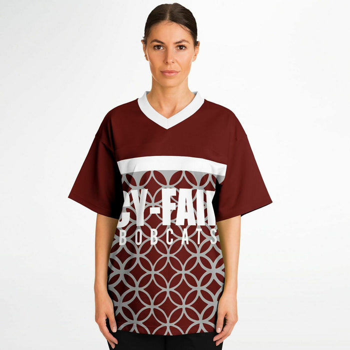 Women wearing Cy-Fair Bobcats football jersey