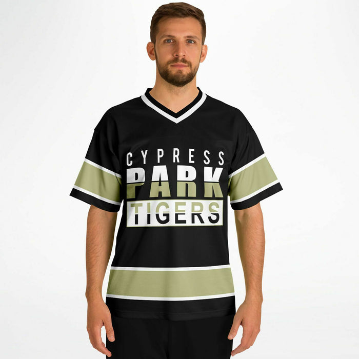 Man wearing Cypress Park Tigers football jersey 13