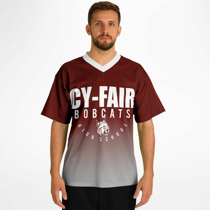 Man wearing Cy-Fair Bobcats football jersey