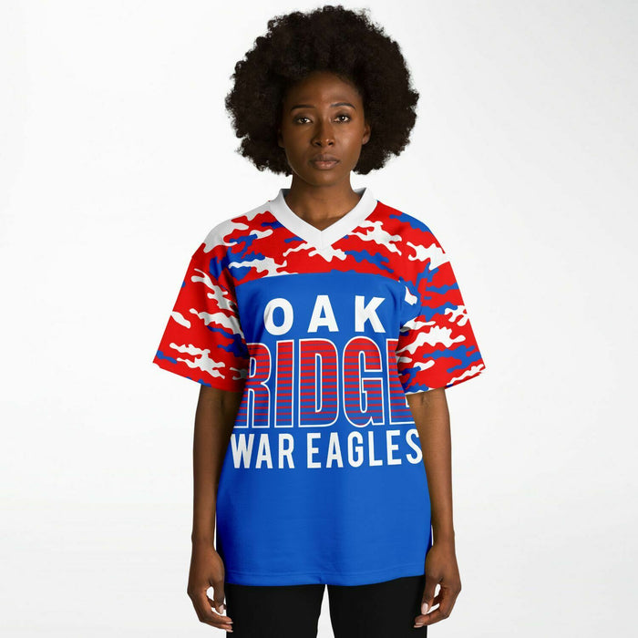 Black woman wearing Oak Ridge War Eagles High School football Jersey