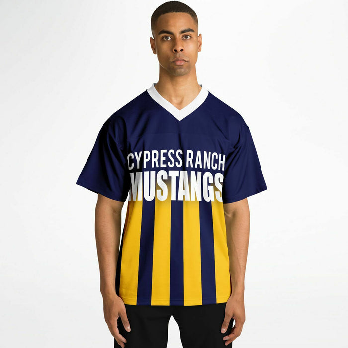 Black man wearing Cypress Ranch Mustangs football Jersey