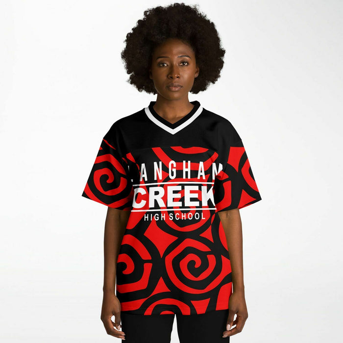 Black woman wearing Langham Creek Lobos football Jersey