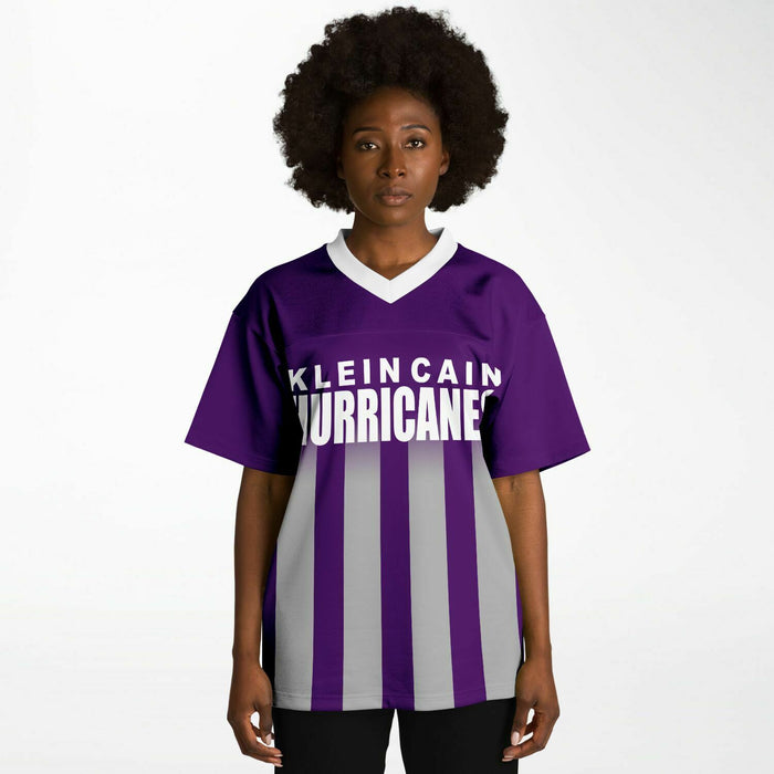 Black woman wearing Klein Cain Hurricanes football Jersey