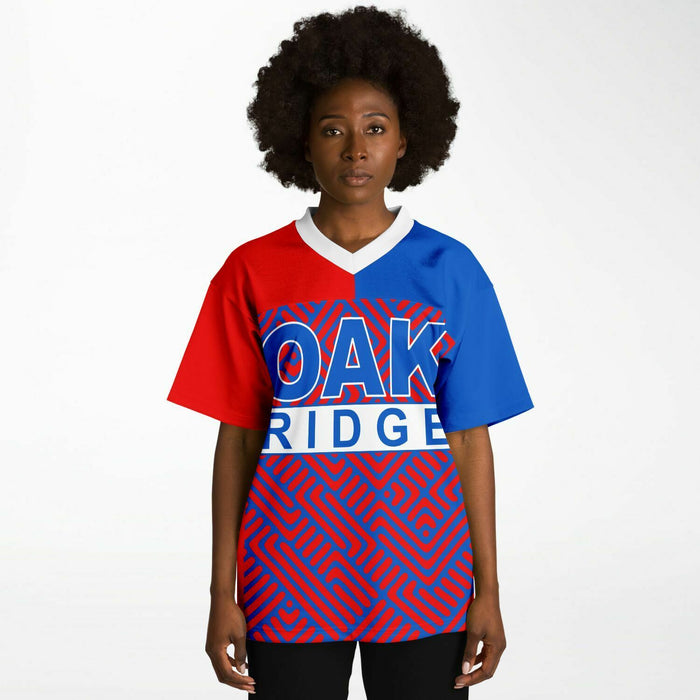 Black woman wearing Oak Ridge War Eagles High School football Jersey