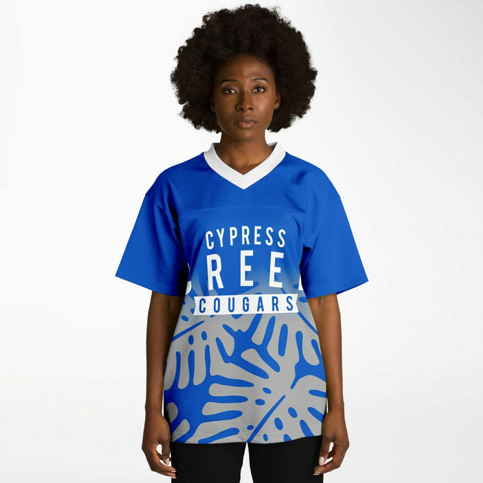 Black woman wearing Cypress Creek Cougars football Jersey