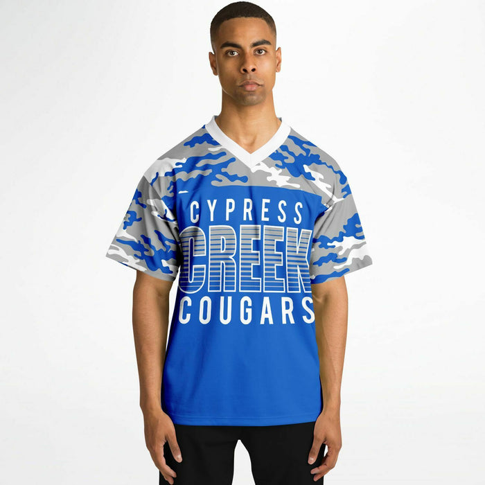 Black man wearing Cypress Creek Cougars football Jersey