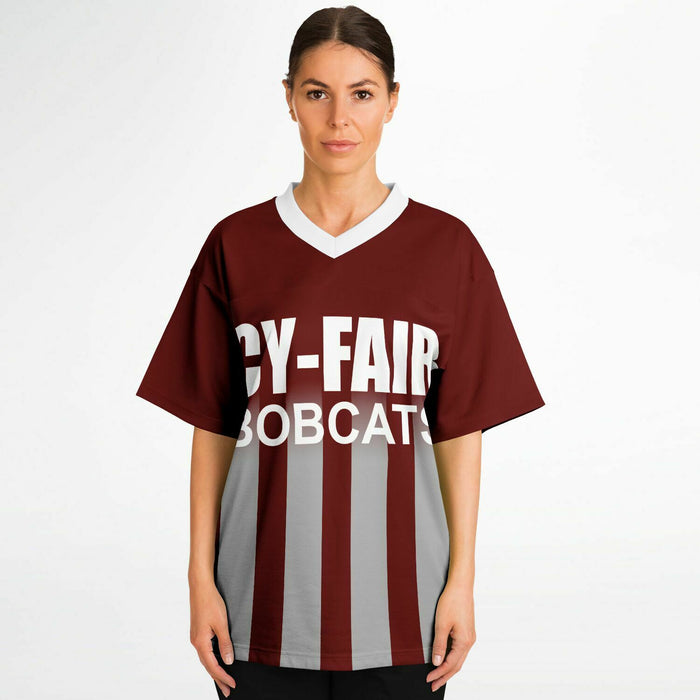 Women wearing Cy-Fair Bobcats football jersey