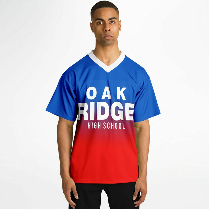 Black man wearing Oak Ridge War Eagles High School football Jersey