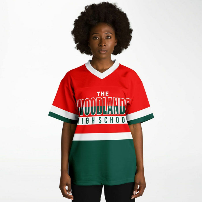 Black woman wearing The Woodlands Highlanders High School football Jersey