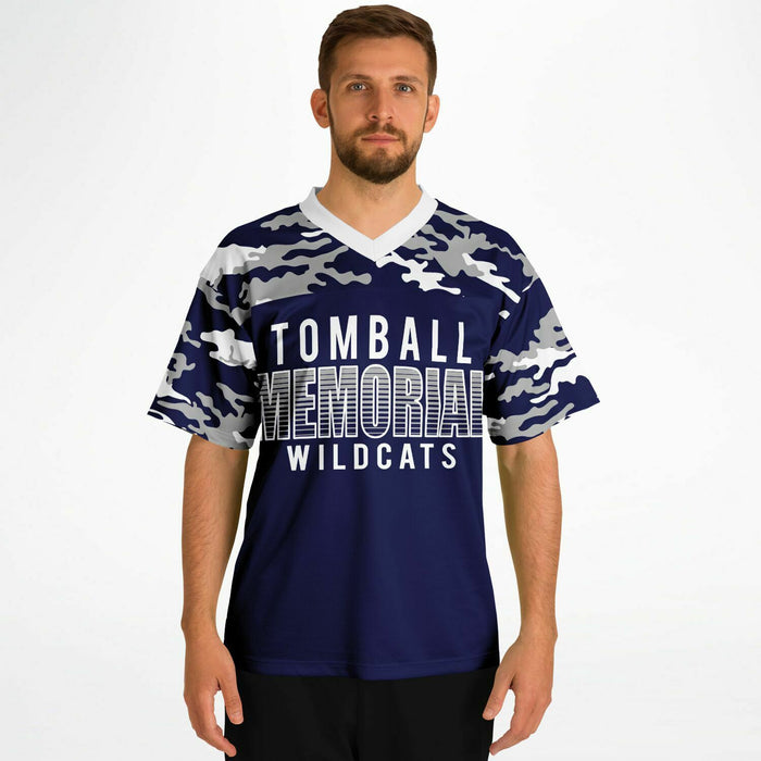 Man wearing Tomball Memorial Wildcats High School football jersey