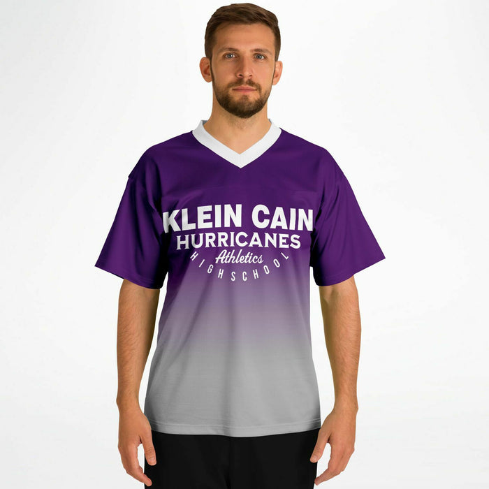 Man wearing Klein Cain Hurricanes football jersey