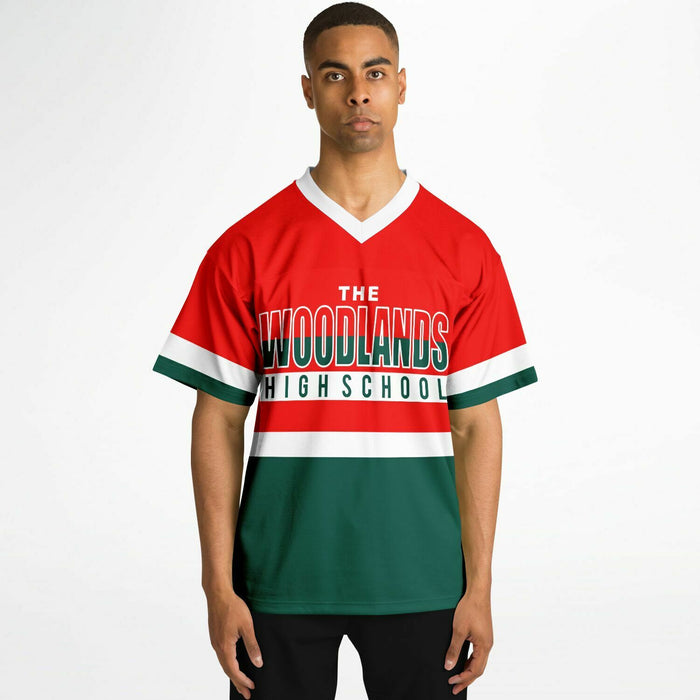 Black man wearing The Woodlands Highlanders High School football Jersey