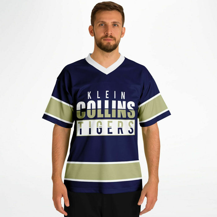 Man wearing Klein Collins Tigers football jersey 13