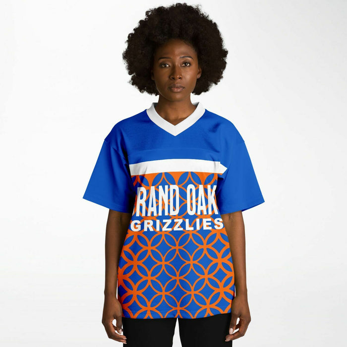 Black woman wearing Grand Oaks Grizzlies football Jersey
