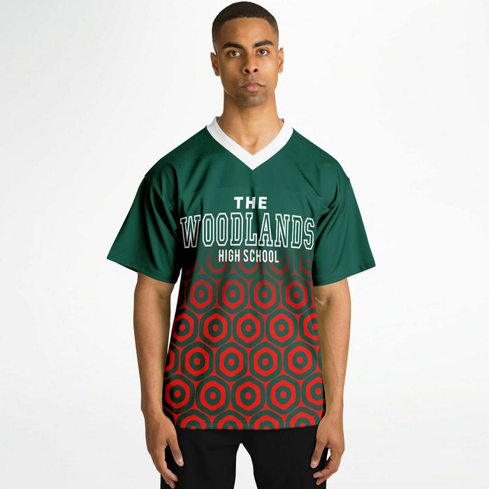 Man wearing The Woodlands Highlanders High School football jersey