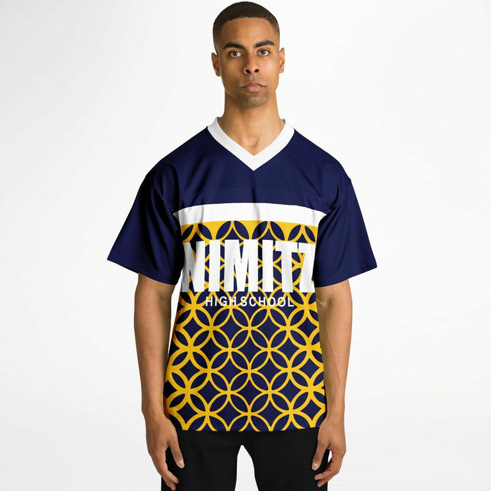 Black man wearing Nimitz Cougars High School football Jersey