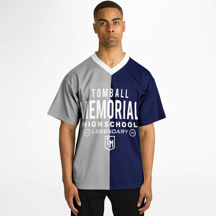 Black man wearing Tomball Memorial Wildcats High School football Jersey