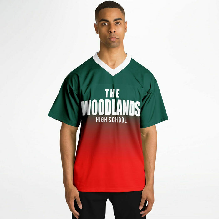 Black man wearing The Woodlands Highlanders High School football Jersey