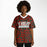 Black woman wearing The Woodlands Highlanders High School football Jersey