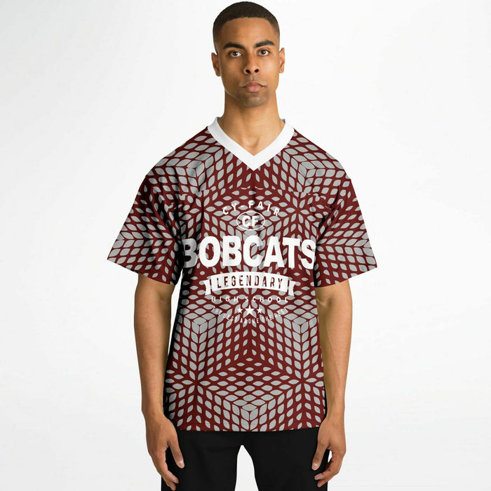 Black man wearing Cy-Fair Bobcats football Jersey