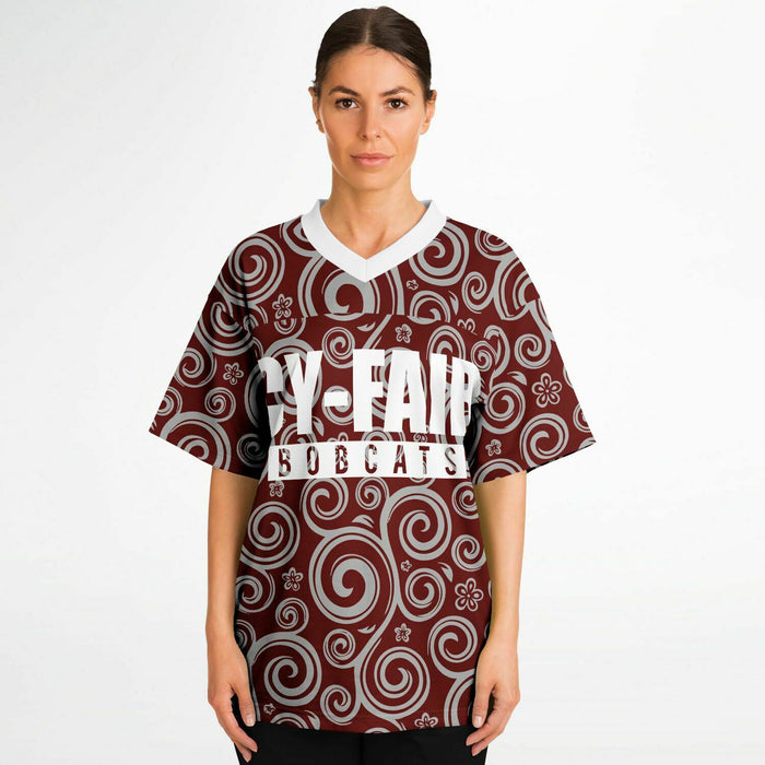 Women wearing Cy-Fair Bobcats football jersey