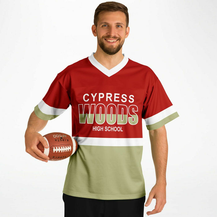 Black man wearing Cypress Woods Wildcats football Jersey 10